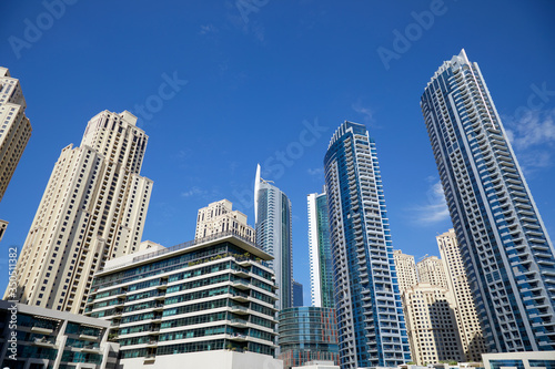 Dubai Marina skyscrapers, low angle view in a sunny day, clear blue sky in Dubai