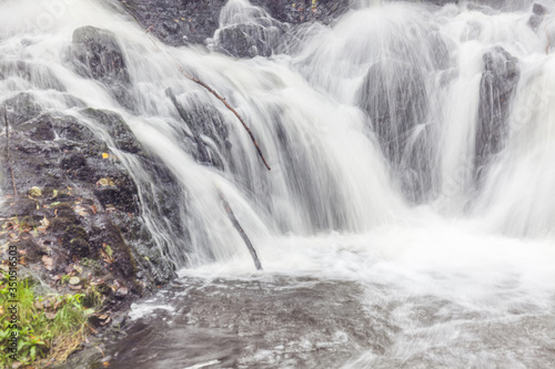 A waterfall in a forest in central Sweden photographed with a long exposure.
