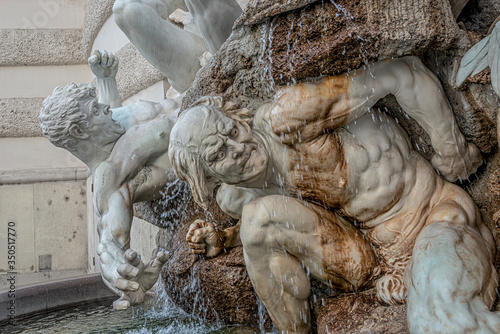 Power of Land fountain at Hofburg Imperial Palace ant Saint Michael Square, outdoor, Vienna, Austria photo