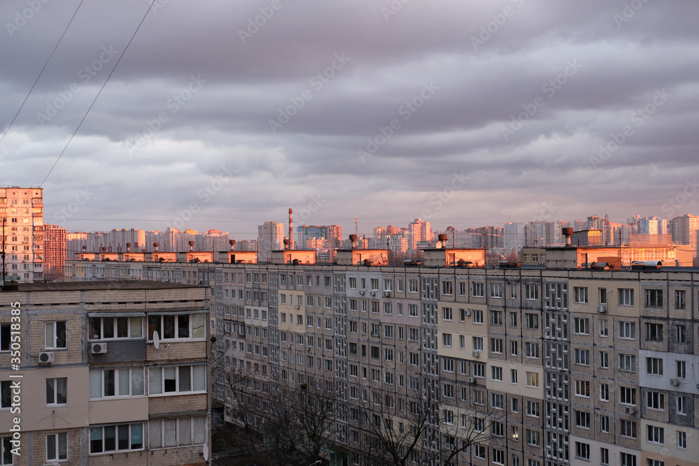 sunset over the roofs of the sleeping area of ​​Kiev