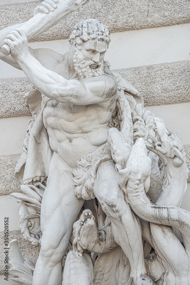 Statue of fight of Hercules with a club and Hydra, serpent like water monster from Classical Greek Mythology, Hofburg Palace, outdoor, Vienna, Austria, details, closeup