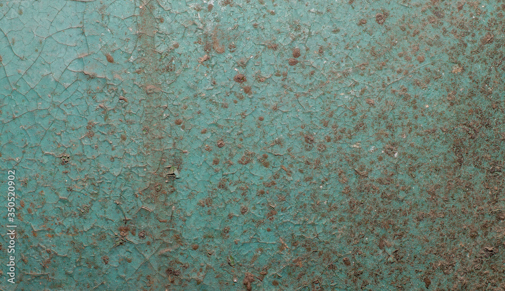 Old painted wall with cracked paint
