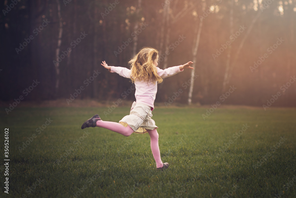 young girl is running in the nature, spring concept young girl is running in the nature, spring concept
