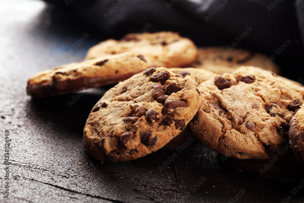 Chocolate cookies on wooden table. Chocolate chip cookies Chocolate cookies on wooden table. Chocolate chip cookies