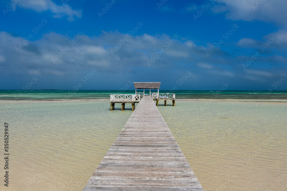 jetty over crystal clear water , cayo Guillermo , Jardine del Rey, Cuba.