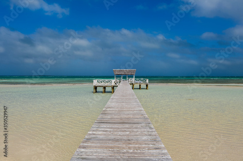 jetty over crystal clear water , cayo Guillermo , Jardine del Rey, Cuba. photo