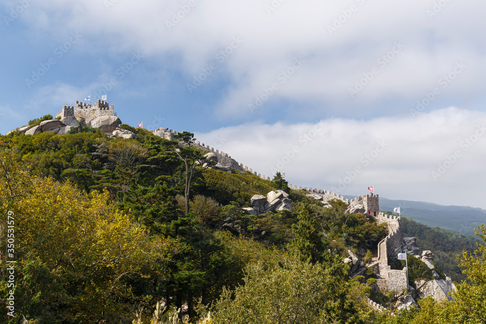 Scenic view of the medieval hilltop castle Castelo dos Mouros (The Castle of the Moors) in Sintra, Portugal.