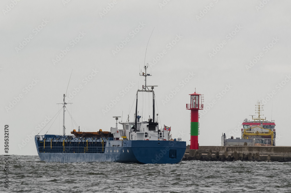 Naklejka premium MARITIME TRANSPORT - Freighters are sailing on a sea voyage 