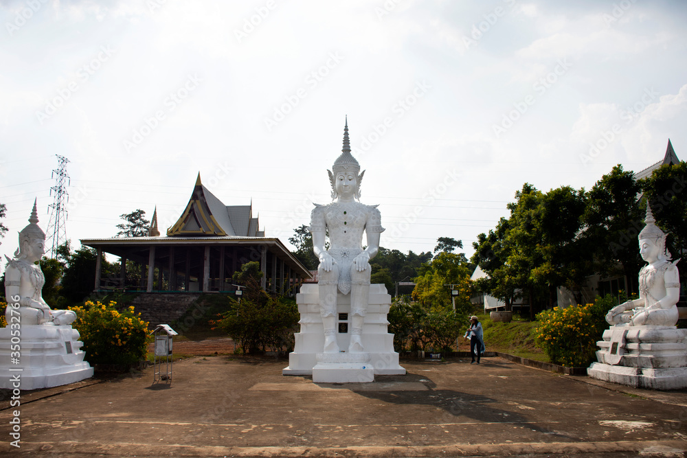 Art buddha statue image of Wat Phra Buddhabat Nam Thip temple for thai people and foreign travelers travel visit and respect praying at Phu Phan city in Sakon Nakhon, Thailand