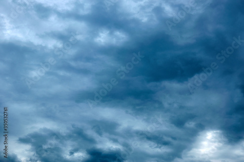 Dark blue gloomy, formidable sky in the clouds.