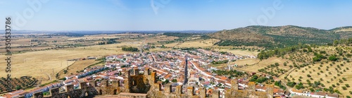 Panoramic view from the inside of Miraflores castle to Alconchel village during a Summer day. In Extremadura, Spain