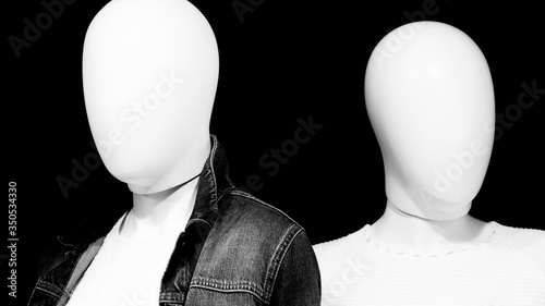 faceless mannequins in shop window