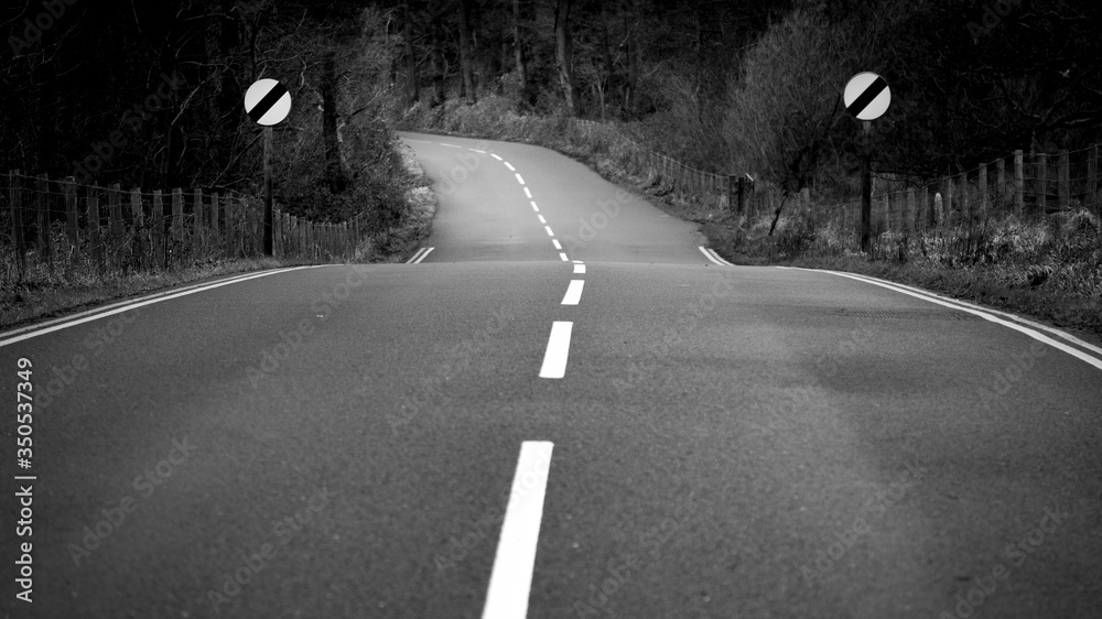 open road in Enlgland and speed limit signs