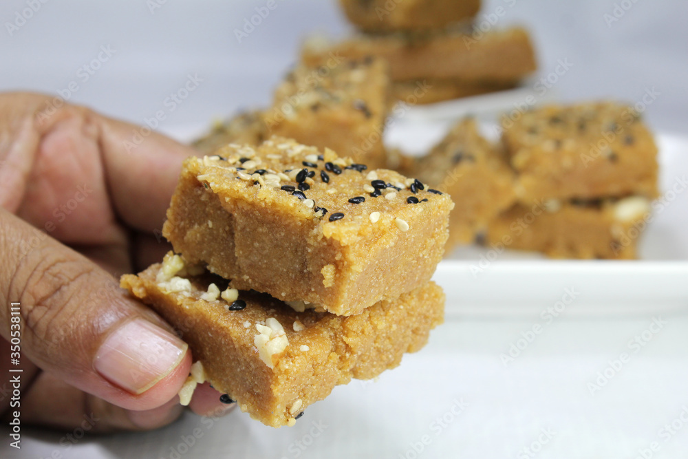 Sukhadi or Gor Papdi is Indian Traditional sweet made with wheat flour,desi ghee,jaggeery and nuts.very healthy Gujarati Mithai Sukhadi or Gor Papdi is Indian Traditional sweet made with wheat flour,desi ghee,jaggeery and nuts.very healthy Gujarati Mithai