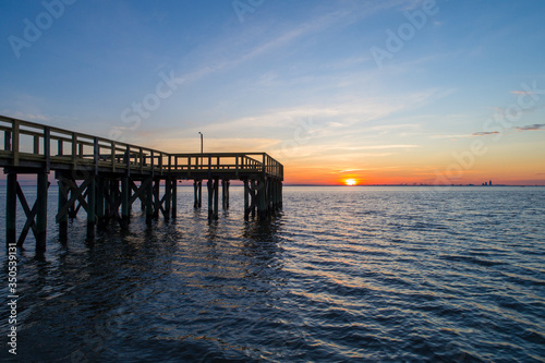 A pier on Mobile Bay  Alabama at sunset 