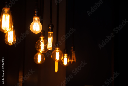 
Edison light bulb. A lot of light bulbs on a black background in a dark room.
abstract background with lots of bulb light. 