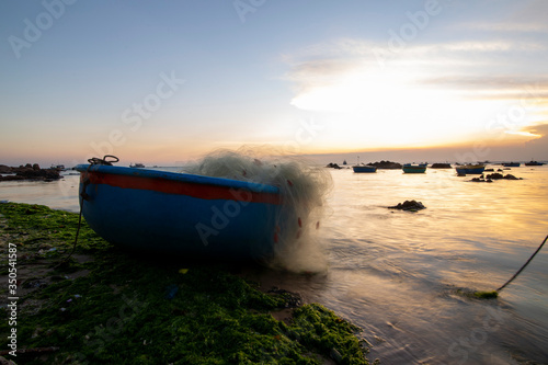 Fishing boats on Binh Thuan beach on the sunrise on Binh Thuan province  Vietnam