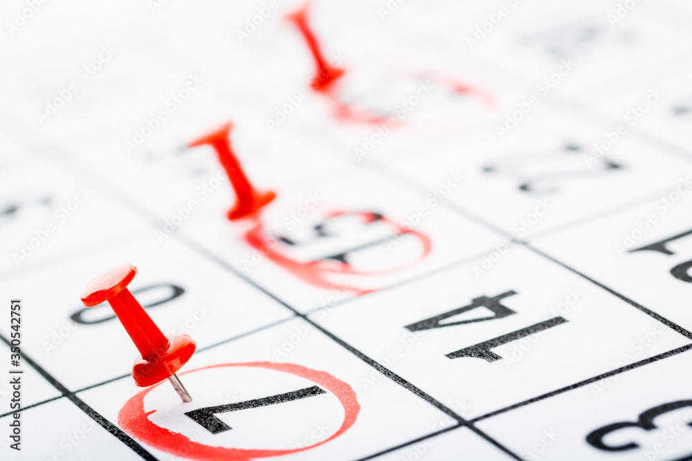 2020 calendar page marked with an important date in red pin. timeline, time, concept, idea, management 2020 calendar page marked with an important date in red pin. timeline, time, concept, idea, management