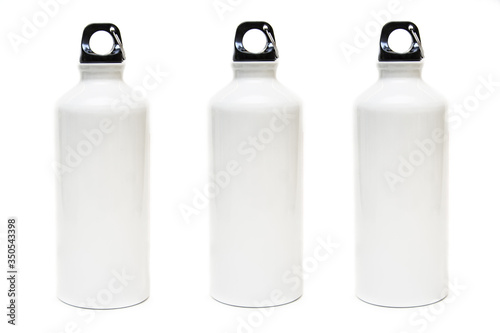 Three white bottles for water on white background.Aluminum eco bottle.Thermos.Products for branding.Merchandise.Drawing a logo of products.Isolated.Place for text.Front view Stop plastic.Eco product