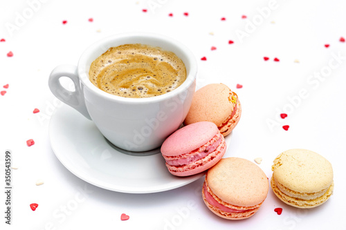 Cup of coffee and macarons for valentines day