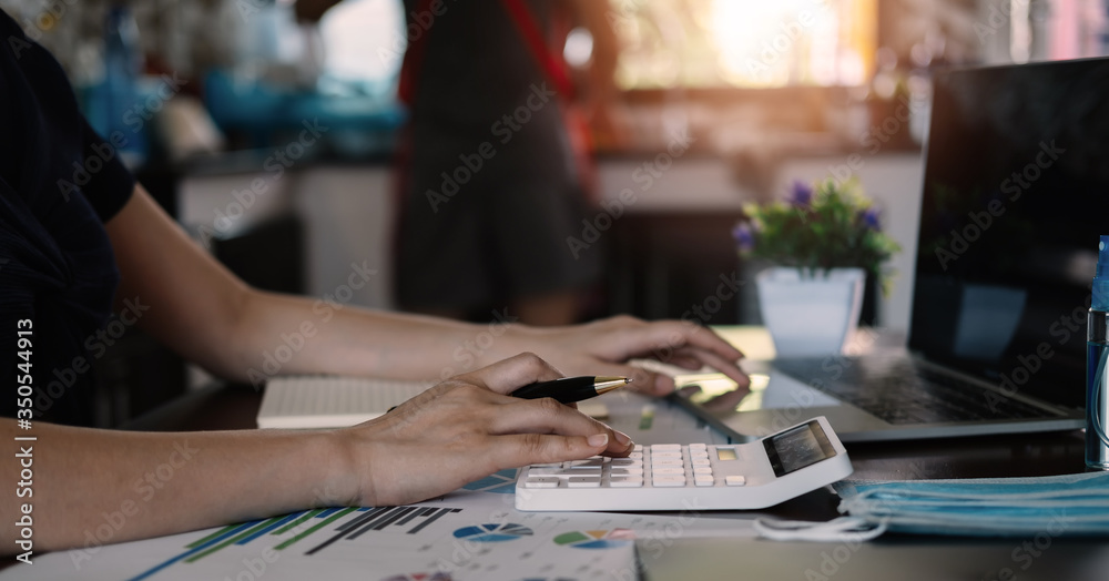 Close up view of bookkeeper or financial inspector hands making report, calculating or checking balance. Close up view of bookkeeper or financial inspector hands making report, calculating or checking balance.