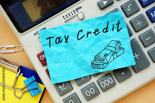 Business concept about Tax Credit with phrase on the sheet.