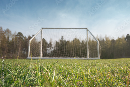 Soccer field in the countryside. Focus on the grass