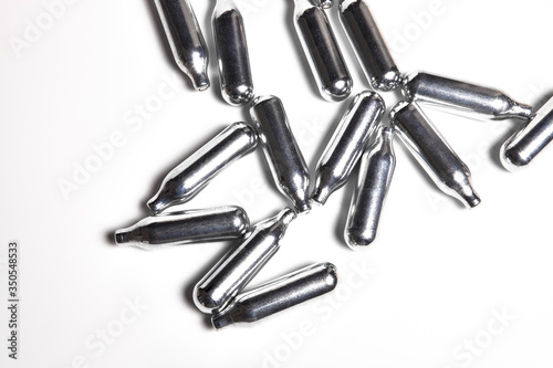 Bild auf Leinwand Closeup of a bunch of silver canisters of nitrous oxide for siphon gourmet cooking