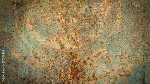 The background image of the iron sheet is rusting caused by prolonged use.Close up of black rust on an old sheet of metal texture. © surasak