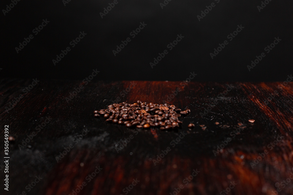 Coffee beans on the wooden table