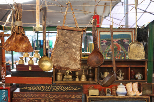 Naran Tuul Market in Ulaanbaatar city, Mongolia. Antique goods on flea market: ancient dishes, other antique, antiquarian things. Shopping in flea bazaar. Ulaanbaatar landmark. Flea antiquarian market
