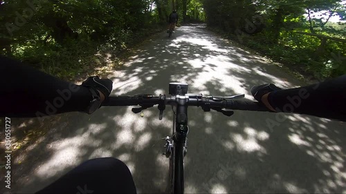 POV View Cycling On Rural Road Surrounded By Trees Near Chalfont, UK Follow Shot photo