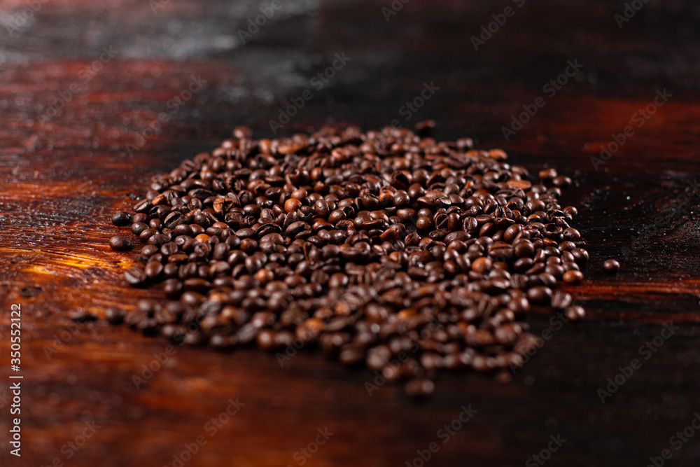 Coffee beans on the wooden table