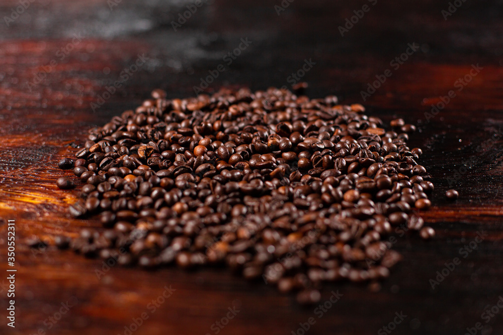 Coffee beans on the wooden table