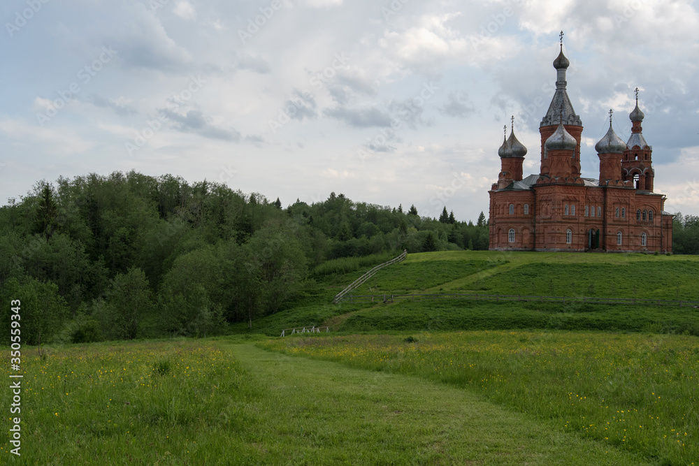 Rural landscape. Preobrazhenskaya church of St. Olga convent (Olgin monastery). Volgoverkhovie village, Tver Oblast, Russia. Rural landscape. Preobrazhenskaya church of St. Olga convent (Olgin monastery). Volgoverkhovie village, Tver Oblast, Russia.