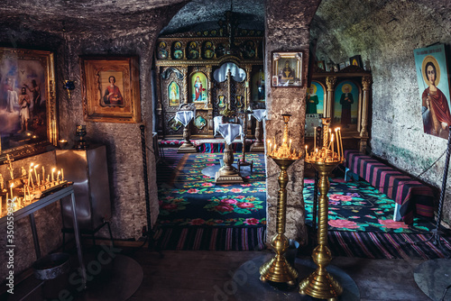 Interior of a cave monastery in Orheiul Vechi natural and historical complex near Trebujeni village, Moldova photo