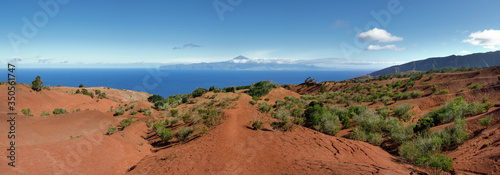 La Gomera - Wanderweg zum Aussichtspunkt Mirador de Abrante durch die rote Erosionslandschaft im Norden mit Blick nach Teneriffa photo