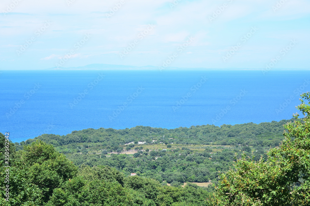 view from the top of the mountain to the coast of the sea over forest in Therma area, Samothraki island, Greece, Aegean sea view from the top of the mountain to the coast of the sea over forest in Therma area, Samothraki island, Greece, Aegean sea