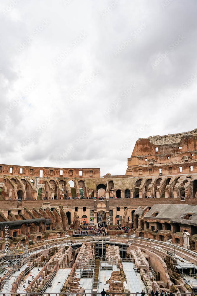 historical Colosseum against sky with clouds in rome