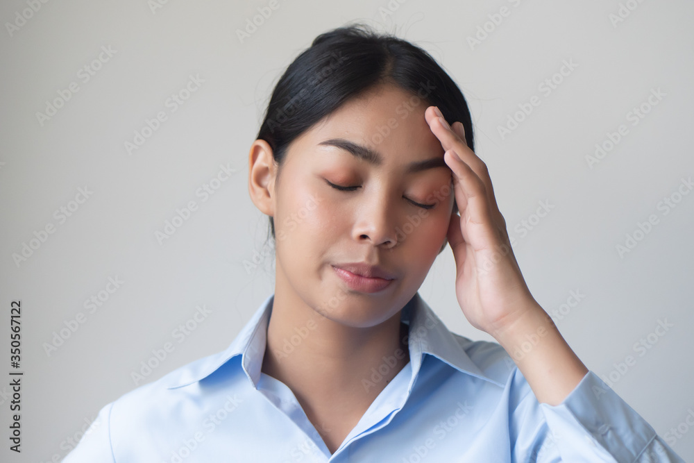 sick woman having headache or fever due to virus infection; concept of health care, disease quarantine, coronavirus outbreak, sickness containment, pandemic, endemic, COVID-19 coronavirus infection sick woman having headache or fever due to virus infection; concept of health care, disease quarantine, coronavirus outbreak, sickness containment, pandemic, endemic, COVID-19 coronavirus infection