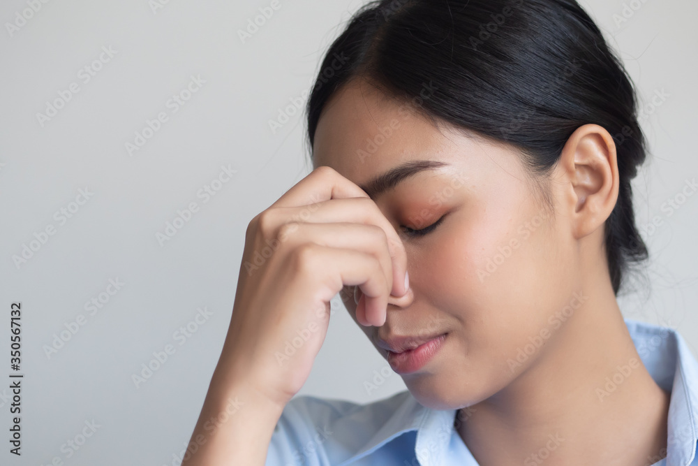 sick woman having headache or fever due to virus infection; concept of health care, disease quarantine, coronavirus outbreak, sickness containment, pandemic, endemic, COVID-19 coronavirus infection sick woman having headache or fever due to virus infection; concept of health care, disease quarantine, coronavirus outbreak, sickness containment, pandemic, endemic, COVID-19 coronavirus infection