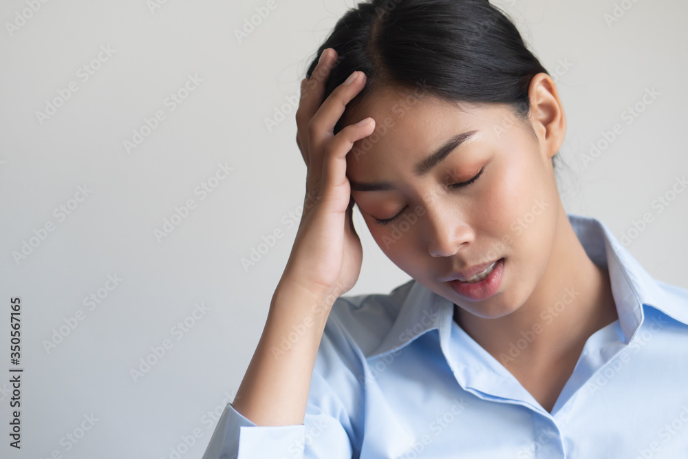 sick woman having headache or fever due to virus infection; concept of health care, disease quarantine, coronavirus outbreak, sickness containment, pandemic, endemic, COVID-19 coronavirus infection sick woman having headache or fever due to virus infection; concept of health care, disease quarantine, coronavirus outbreak, sickness containment, pandemic, endemic, COVID-19 coronavirus infection
