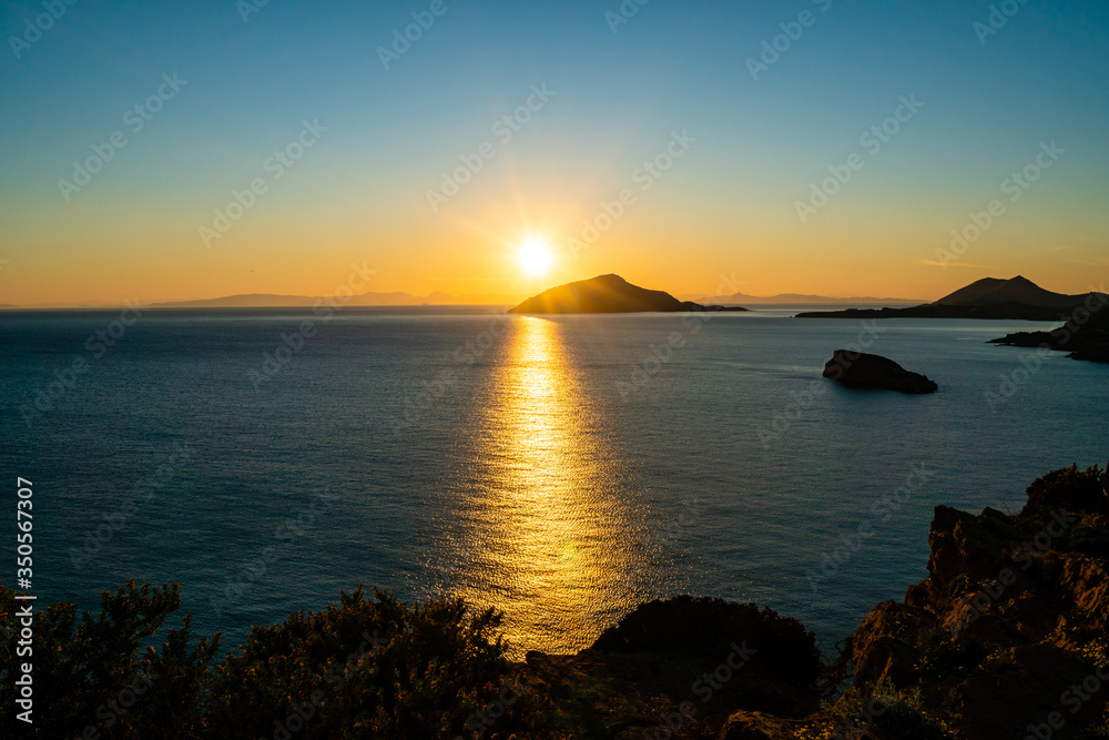 Sunset near scenic Aegean sea in Greece