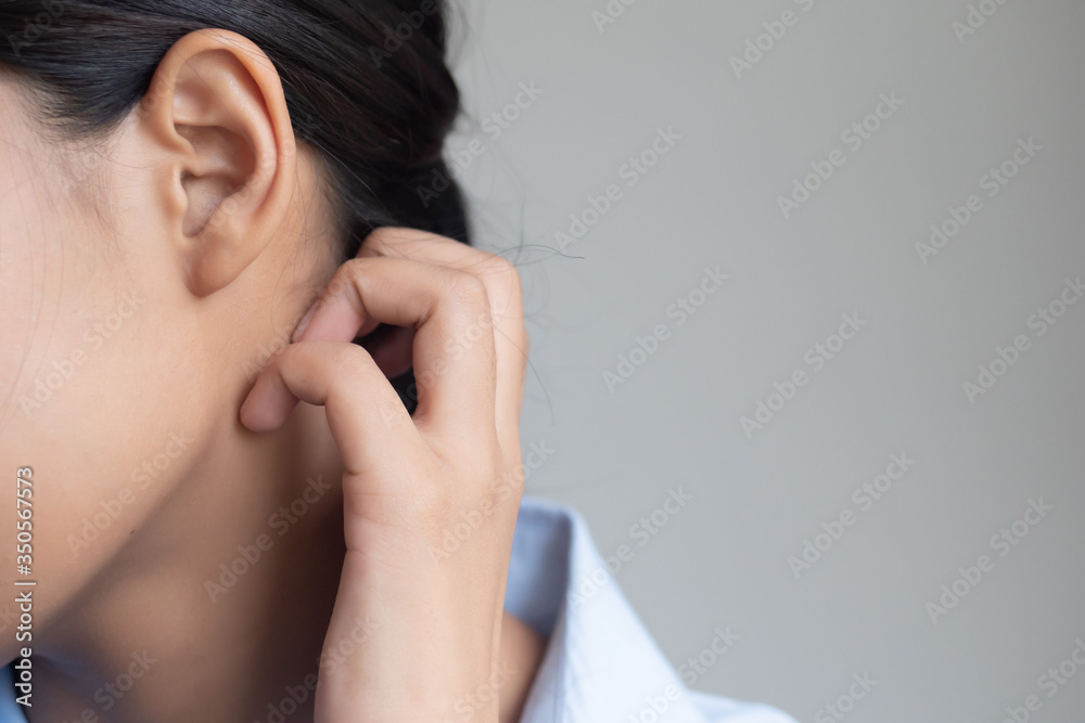 woman scratching her neck skin; dry skin, allergic skin inflammation, body care, fungus inflammation, dermatology disease, eczema, ringworm, rash, skin care concept; young adult asian woman model woman scratching her neck skin; dry skin, allergic skin inflammation, body care, fungus inflammation, dermatology disease, eczema, ringworm, rash, skin care concept; young adult asian woman model