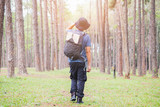 Asian man with backpack hiking in forest , Adventure Travel Remote Relax Concept