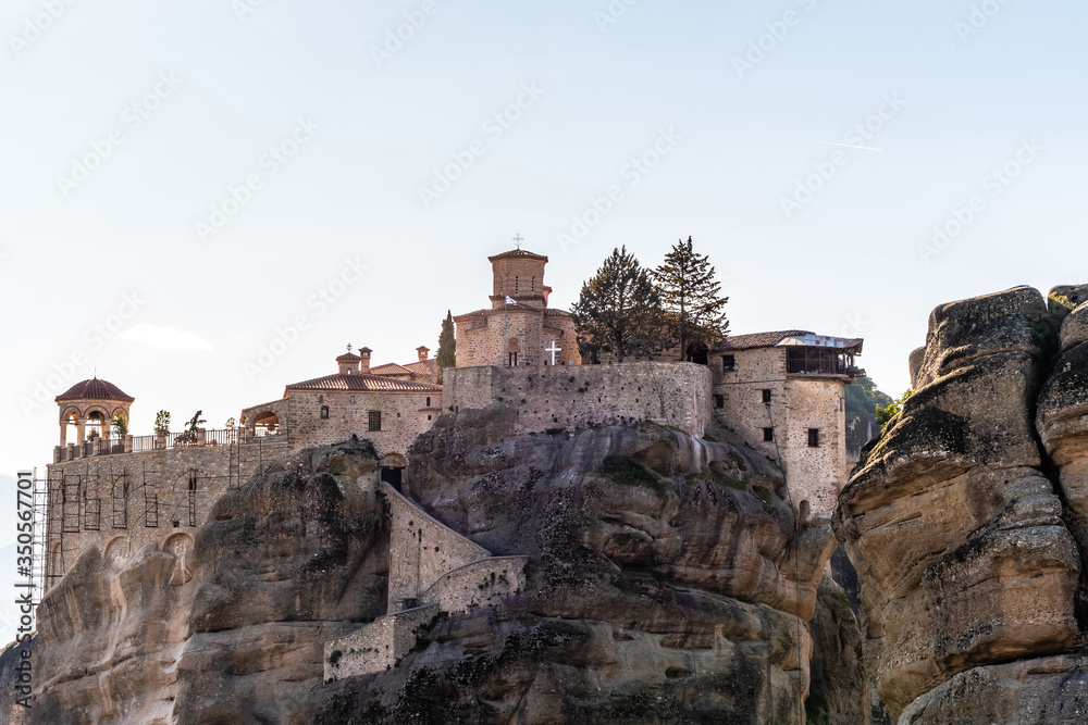 Rock formations with orthodox monastery in meteora