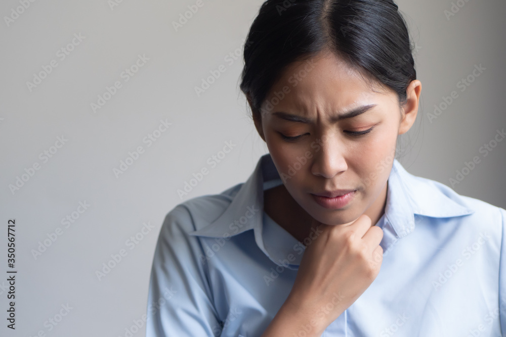 sick woman with sore throat portrait; sick woman with sore throat, cold, flu, contagious disease, cold or flu spreading, virus outbreak, coronavirus, COVID 19, pandemic, endemic health care concept sick woman with sore throat portrait; sick woman with sore throat, cold, flu, contagious disease, cold or flu spreading, virus outbreak, coronavirus, COVID 19, pandemic, endemic health care concept