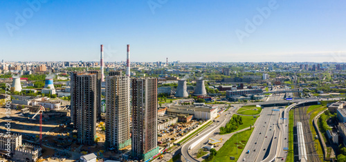 Aerial top view of road junction in Moscow from above, automobile traffic and the old Ugreshskaya railway station in the Moscow industrial zone near the automobile ring highway