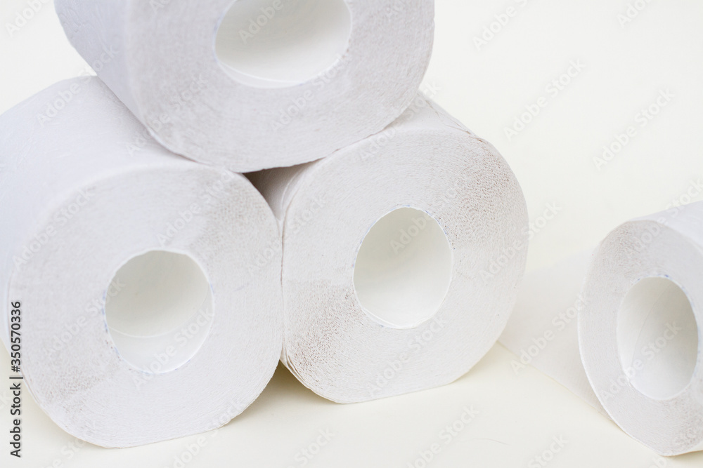 Rolls of toilet paper on white. Pile of paper. Coronavirus fear Rolls of toilet paper on white. Pile of paper. Coronavirus fear