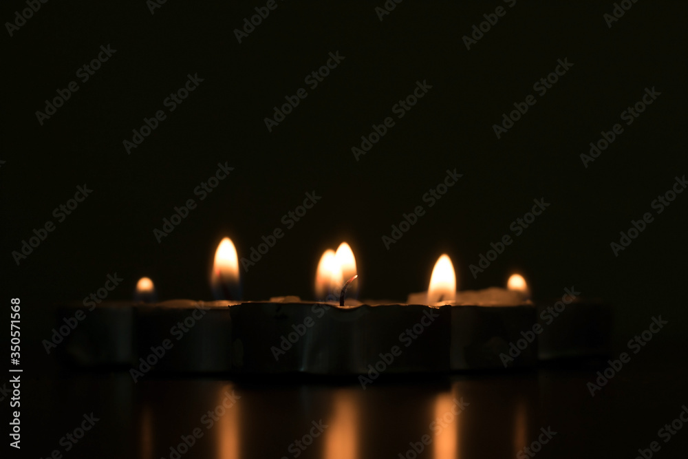A small candle or light in the dark A small candle or light in the dark